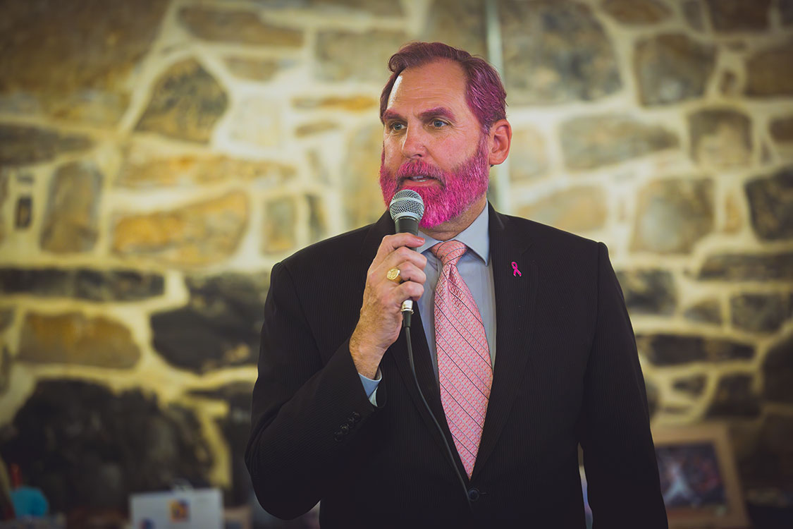 Photo of Paul Frey with pink hair and beard.